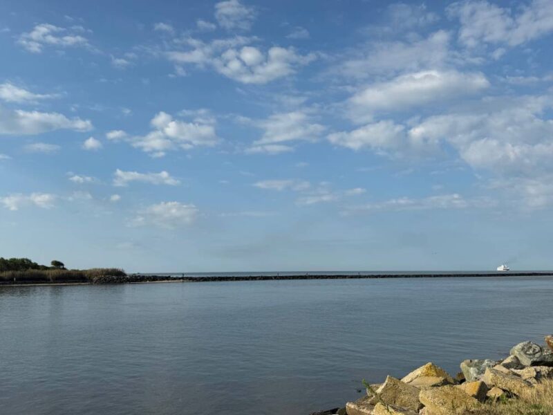 Cloudy Blue Skies over the Delaware Bay, calm waters