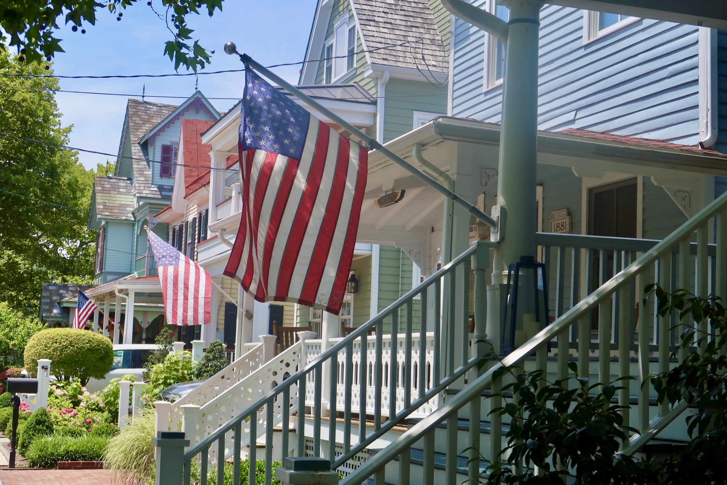 American Flags posted on a row of porches