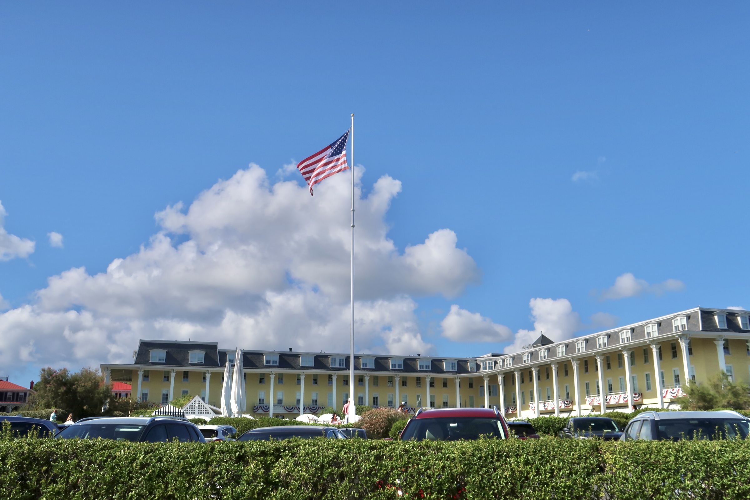 Congress Hall under a big blue sky with flag flying
