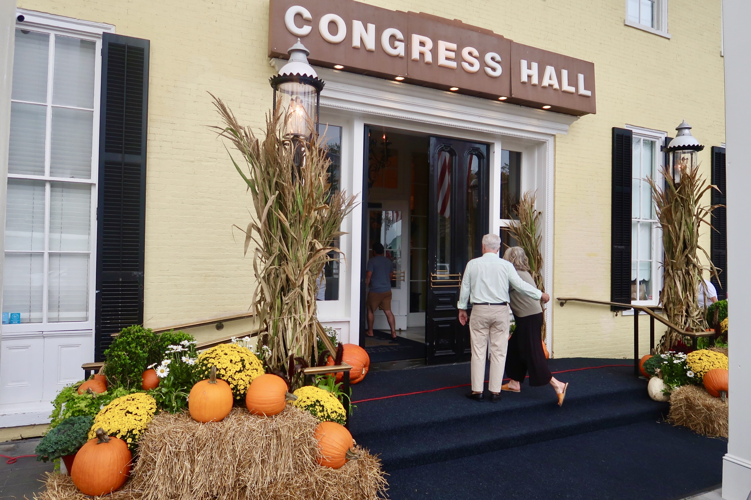 Couple walking into Congress Hall dressed up for Fall