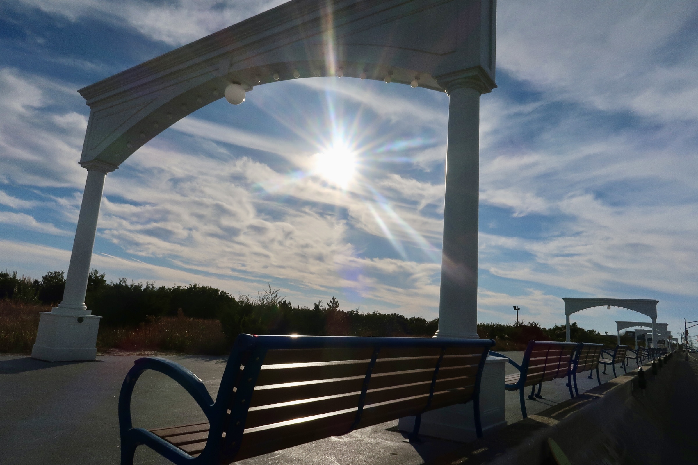 Sun shining under arches on the promenade 