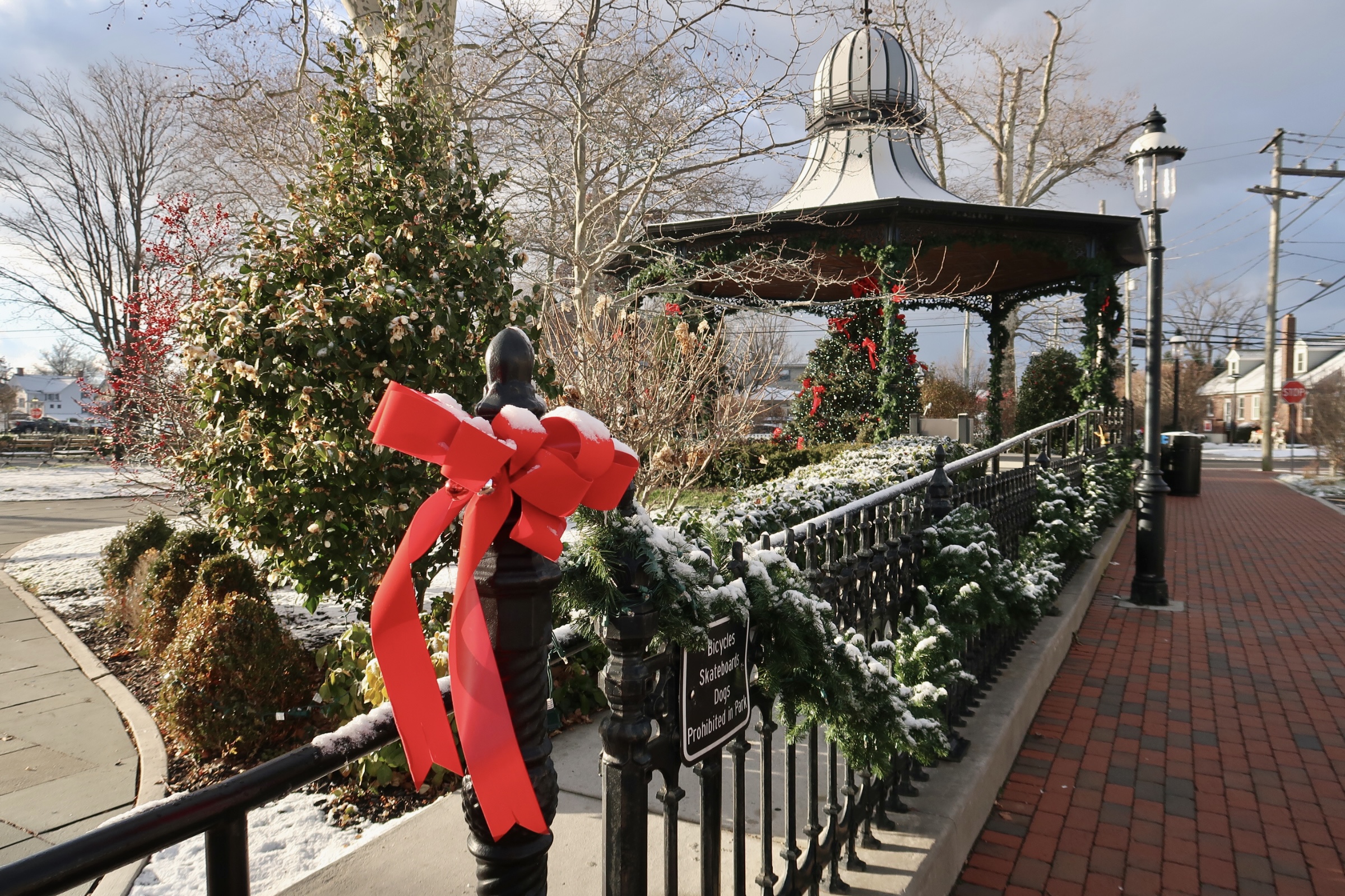 Rotary park Christmas tree in gazebo with snow