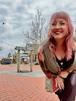 Jess Formento in front of the Cape May bell on the mall